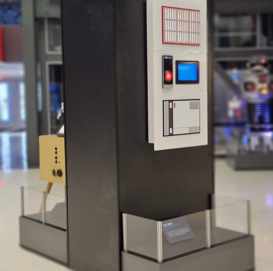 HAL 9000 sitting in the Robot Hall of Fame.