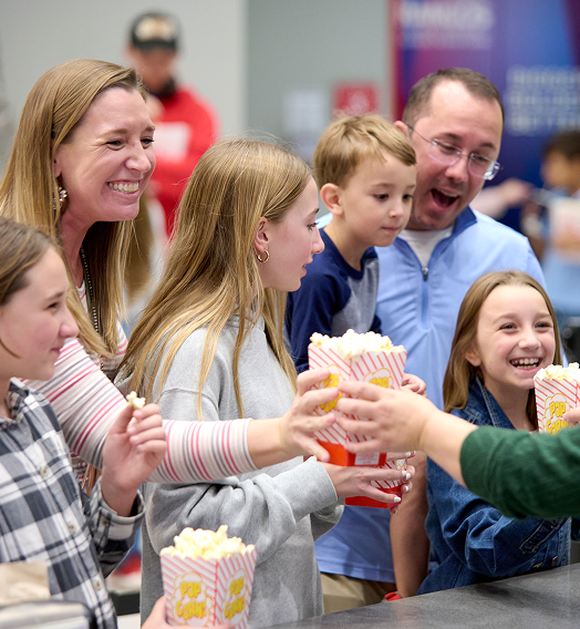 Family purchasing concessions in the Rangos Giant Cinema lobby.