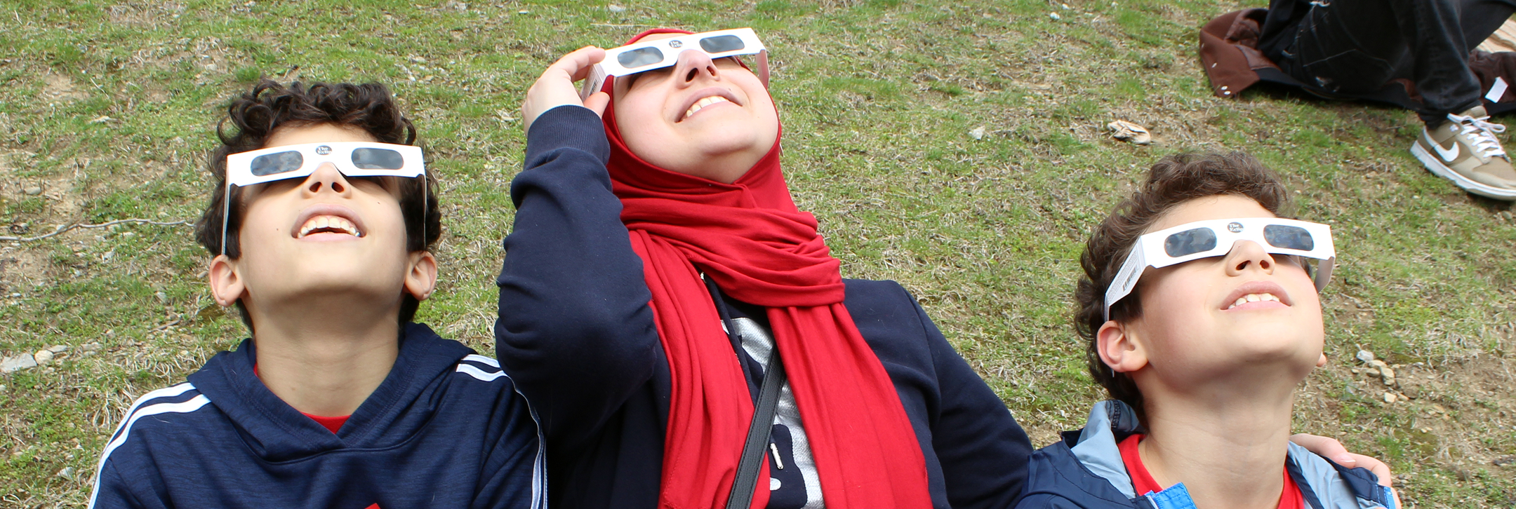 A family participating in a solar eclipse viewing event
