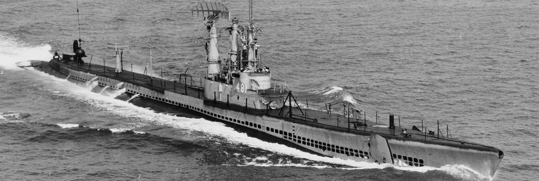 USS Requin (SS 481) submarine in open water.