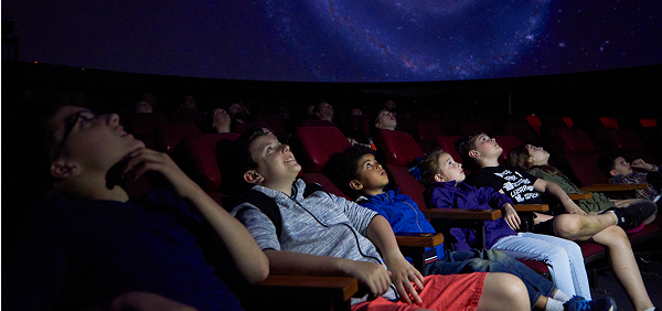 Kids watch a Buhl Planetarium show.