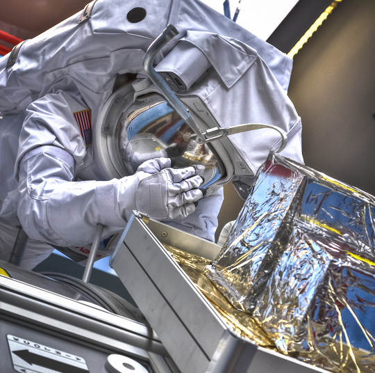 An astronaut suit suspended in air at the Kamin Science Center.