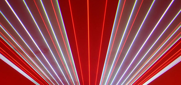 Colorful lines are projected during a laser show.