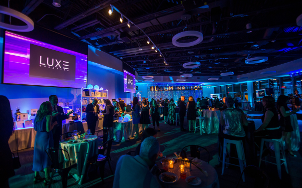 Elegant and darkly-lit indoor event space.