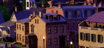 A model of homes situated in the Miniature Railroad & Village exhibit.