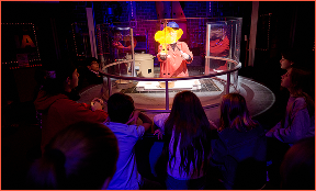 A science experiment that is producing fire during a live show.