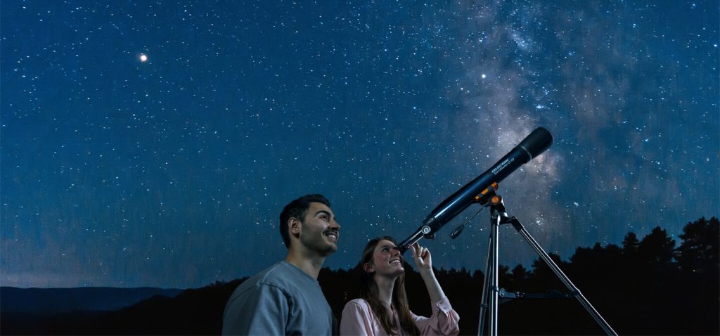 A couple with a telescope