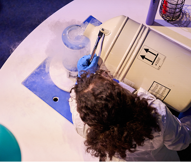 A Science Center staff member is conducting a demonstration.