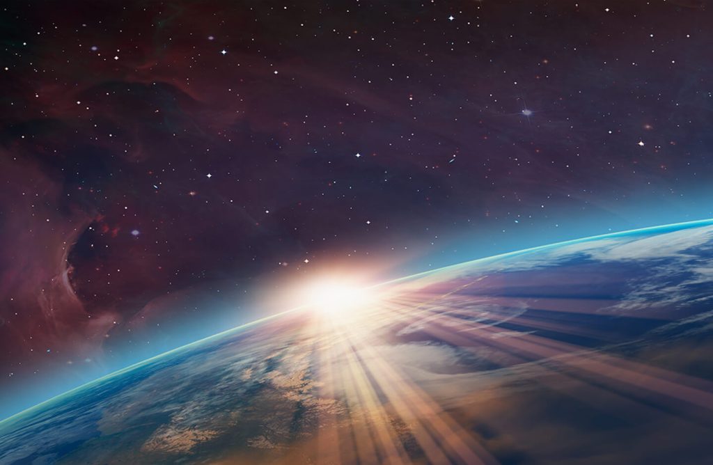 The Sun coming over the horizon of Earth as seen from outer space.