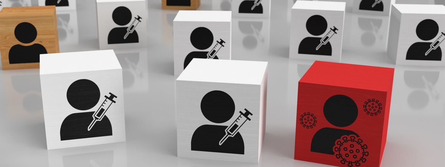 Various blocks with people drawn on them. One red block with a virus drawn on it and several white blocks with a syringe drawn.
