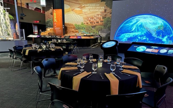 Decorated tables and chairs in the Mars exhibit