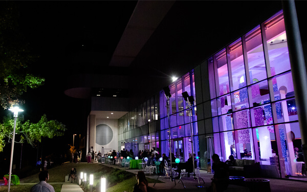 Exterior of the Science Center at night during a special event