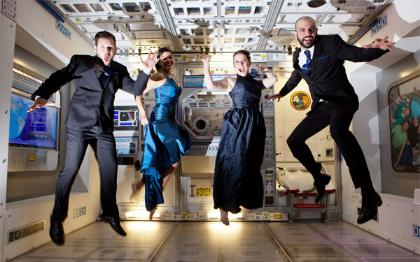 A wedding party jumping in mid-air