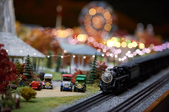 A miniature train and Model T cars