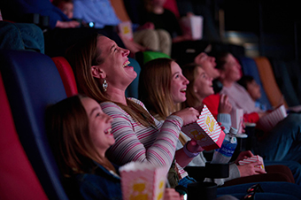 Guests sitting in a movie theater
