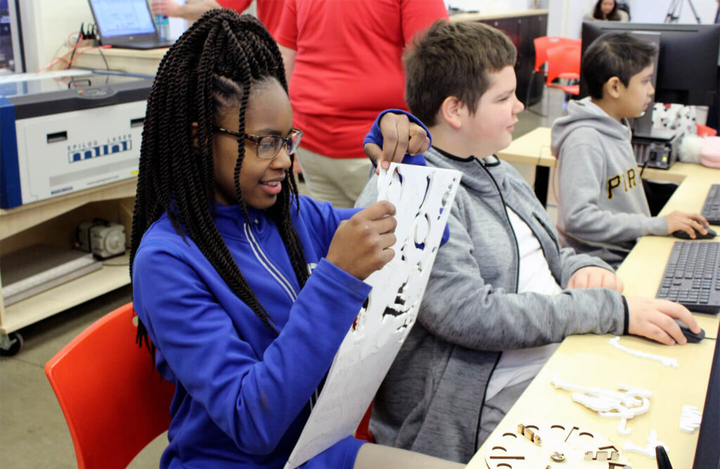 A girl removing 3D pieces of a puzzle